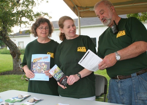 Tri Community CERT in action distributing disaster preparedness information. Photo courtesy of Kataharine Kurkov, Hillcrest Patch. See the entire story at http://hillcrest.patch.com/articles/cert-needs-volunteers-for-disaster-response